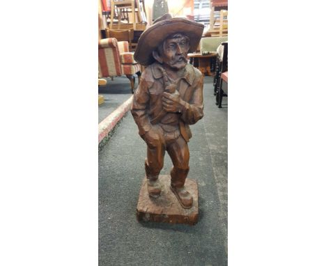 RESIN FIGURE OF AN OLD PERSON SMOKING A PIPE, APPROX 29" TALL