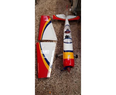 STUNT PLANE MODEL OF A YAK 54 STUNT PLANE WITH ENGINE & APPROX 58" WING SPAN, WINGS DETACHED.