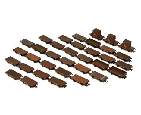 Collection of flatbed and three plank wagons, mostly Bachmann, some Mainline and some Airfix 