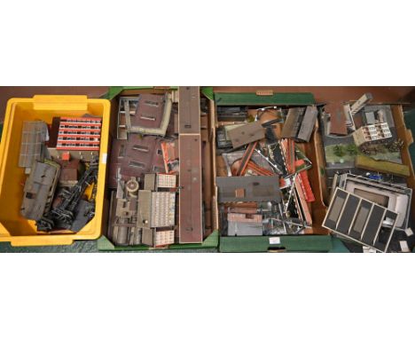Four boxes of kit built buildings, many industrial and lighting gantries  