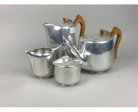 PICQUOT WARE FOUR PIECE TEA AND COFFEE SERVICE, comprising tea pot, coffee pot, cream and sugar