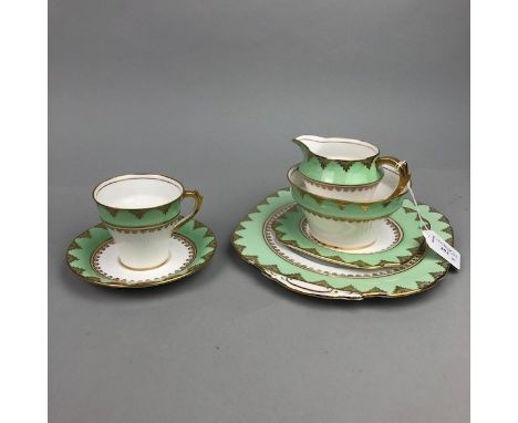 ROSSLYN TEA SERVICE with green and gilt borders, comprising 11 cups, 12 saucers, 12 side plates, 2 cake plates, 2 pickle dish