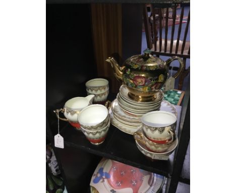 LEONORA TEA SERVICE, comprising six place settings, along with a floral and gilt tea pot