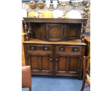 OAK DINING SUITE, comprising a dining table, five chairs with brass button detail and a buffet