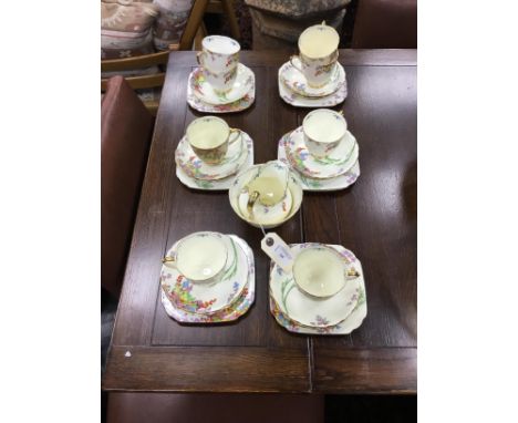 NEW CHELSEA STAFFS PART TEA SERVICE, decorated with colourful fruiting vines, on a cream ground, comprising 8 cups, 11 saucer