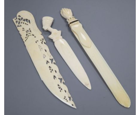 An ivory and pique work 'fist' page turner and two paper knives