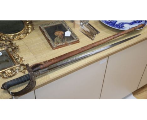A George V 1897 pattern infantry officer's sword in field scabbard (a.f.)