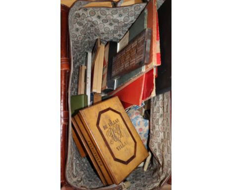 A quantity of board games, cards, shakes and a collection of cribbage boards in a large Gladstone-style bag