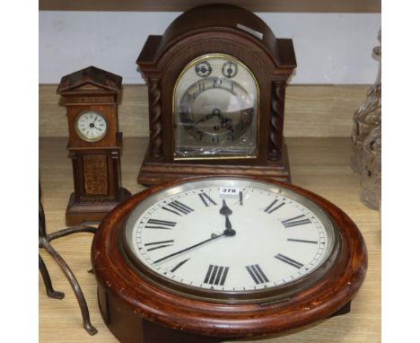 A miniature longcase clock, a wall clock and an oak mantel clock