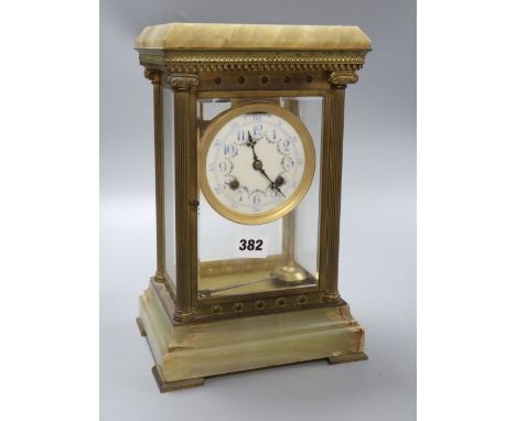 A four glass onyx and brass clock, height 31cm