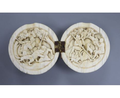 A 19th century Dieppe ivory noix ball diptych, the interior carved with hunting scenes, 5.5 diameter