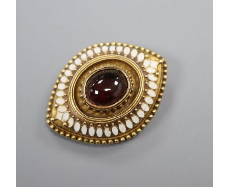 An Etruscan Revival yellow metal, white enamel and garnet navette-shaped brooch with glazed back