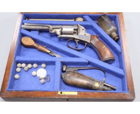 A cased self cocking five-shot double action revolver, engraved 'Adams London' '1091', of Webley Bentley type, spurless hamme