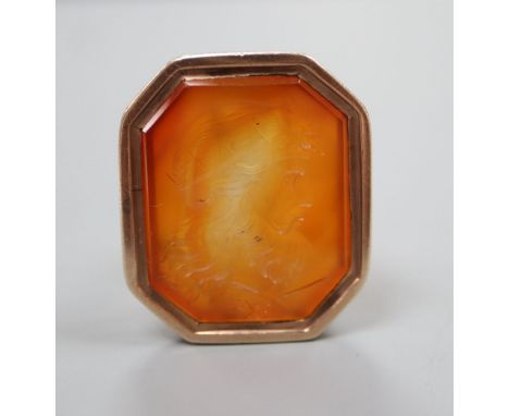 A late Georgian yellow metal and carnelian intaglio seal, 3.2cm