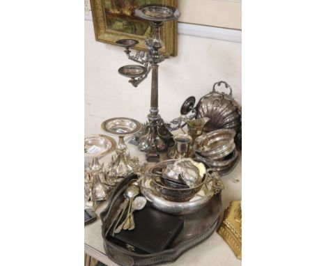 A collection of silver plate including a three branch four light candelabra, two smaller candlesticks, etc.