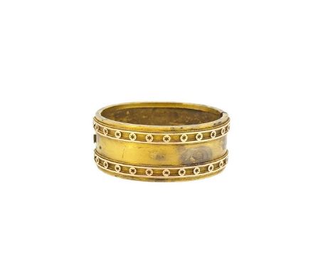 A Victorian cuff bangle, plain polished with two rails of pierced star decoration, inside diameter 5.6cm, width 2.5cm, push-i