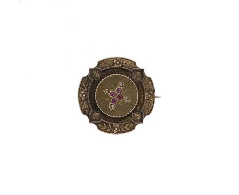 A Victorian ruby and diamond brooch, raised central section set with four oval faceted rubies and four rose cut diamonds, wit