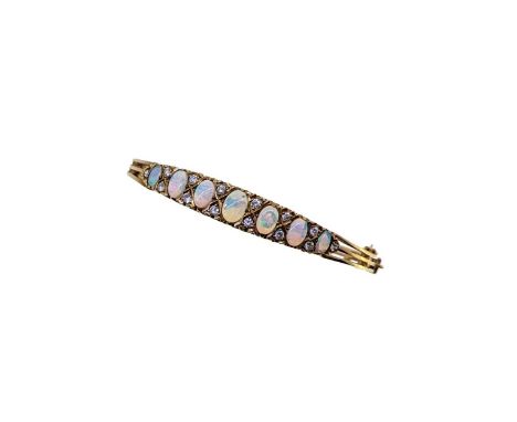 A late 20th century 9ct gold opal and diamond hinged bangle, seven graduated oval cabochon opals, from approximately 5 to 7mm
