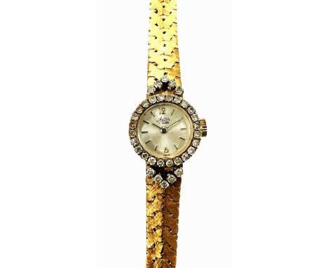 Antor - A Swiss diamond set wristwatch, circa 1960, the signed circular silvered dial, 12mm diameter, with silver coloured ba