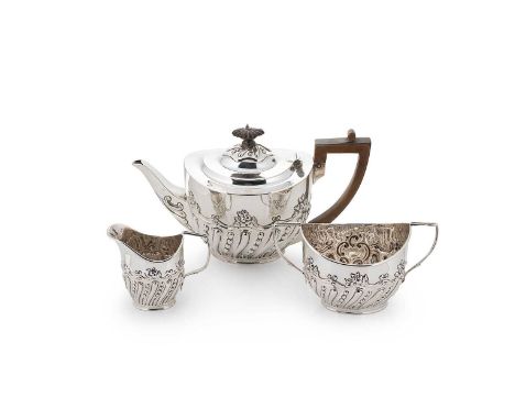 A Victorian silver three-piece tea set, mark of Charles Stuart Harris, London 1899, the teapot of oval form, lower with repou