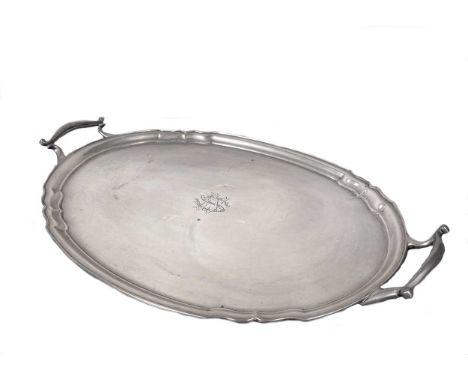 A George V silver two handled tray, mark of Roberts &amp; Belk, Sheffield 1925, of oval form with scalloped rim, the field wi