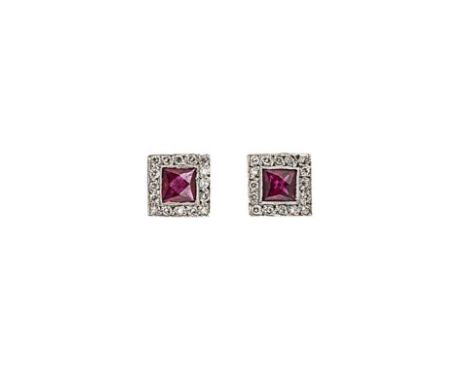 A pair of ruby and diamond ear studs, square shaped panels, each set with a central square faceted ruby, surrounded by round 