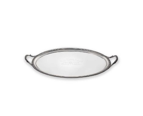 A George III silver two handled tray, mark of John Crouch II, London 1808, of oval form with gadrooned rim, two leaf capped g