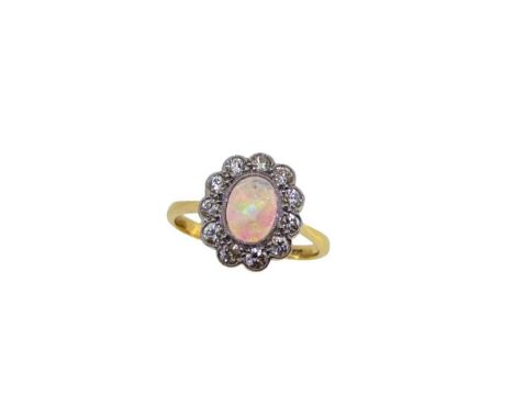 An opal and diamond cluster ring, rubover set oval cabochon opal, approximately 7.2 x 5.4mm, estimated approximate weight 0.5