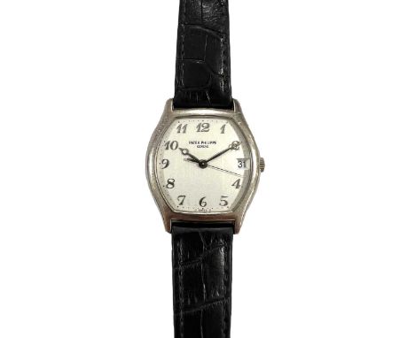 Patek Philippe - An 18ct white gold wristwatch, circa 2003, model 5030, the signed tonneau shaped opaline-white dial, 27mm wi