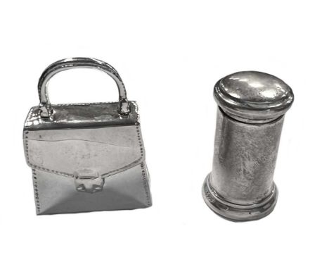 Two 20th century novelty pill boxes, marks of Tiffany & Co. and Asprey & Co.,  the first, modelled in the form of a handbag w