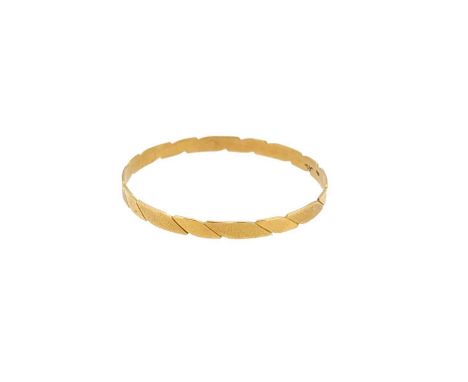 A modern plain bangle, polished and textured bevelled design, no clasp, inside diameter 6.2cm, width 5.9mm, unhallmarked, sta