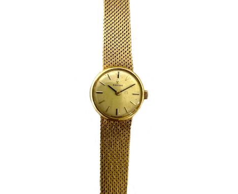Omega - A Swiss 18ct gold wristwatch,  circa 1969, model number 7181, the signed circular champagne dial, 18mm diameter, with