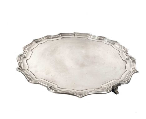 A George V silver salver, probable mark of William Adams Ltd., Birmingham 1932, 'Chippendale' style, raised on 3 cast and app