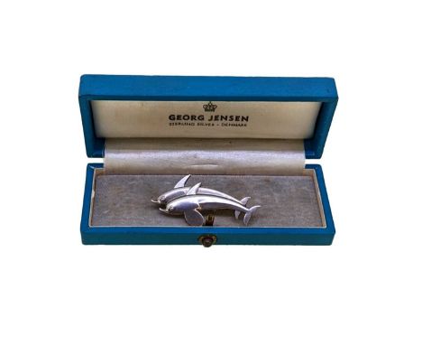 Georg Jensen - A dolphin brooch, modelled as twin swimming dolphins, dimensions 4.2 x 2.2cm, pin and roller catch fitting, si
