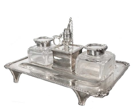 A Victorian silver desk inkstand, mark indecipherable, London 1900, the base of rectangular form with turned corners and foli