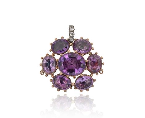 A Georgian amethyst and diamond pendant/brooch, central oval faceted amethyst approximately 21.5 x 18mm, surrounded by six sm
