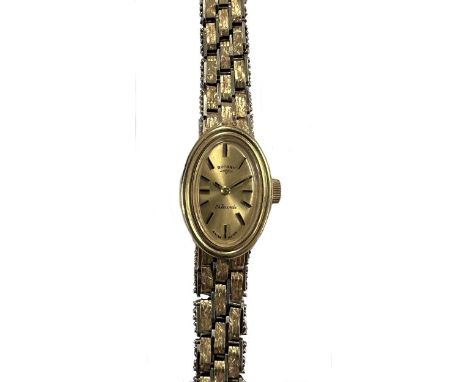 Rotary - A 9ct two-colour gold wristwatch, circa 1975, the signed oval champagne dial, 12mm wide, with black batons and hands
