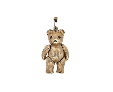 A 9ct gold teddy bear pendant, articulated teddy bear with a textured finish and round faceted garnets for eyes, tapered bale