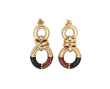 A pair of enamelled ear pendants, each with two articulated ovals, the bottom decorated with red and black enamel, length 3.9