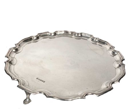 An Elizabeth II silver salver, mark of Francis Howard Ltd., Sheffield 1977, Jubilee marked, 'Chippendale' style, raised on 3 