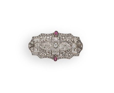 An Art Deco ruby and diamond panel brooch, central old mine cut diamond, estimated approximate weight 0.30ct, surrounded by f