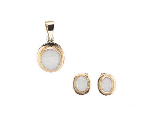 An opal pendant, together with a pair of matching opal ear studs, oval shaped pendant with a central oval shaped cabochon opa