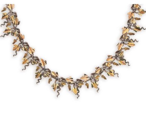 Brett Payne - An 18ct gold and silver grape vine and corkscrew necklace, twisted grape vine and corkscrews with applied gold 