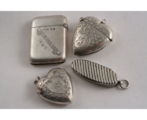 A VICTORIAN SILVER OVAL VESTA CASE with diagonal fluting, by S. Mordan & Co.,  London 1890, another silver example inscribed 