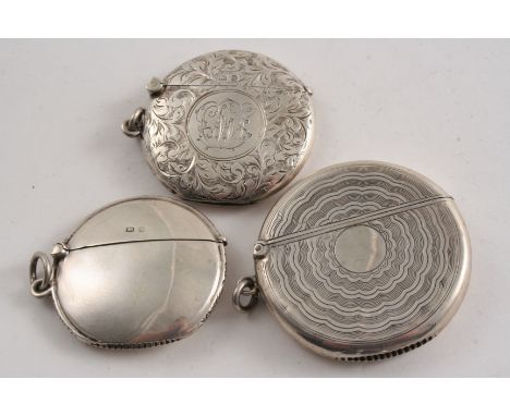 THREE SILVER CIRCULAR VESTA CASES:- An engine-turned example, Chester 1908, a plain example Birmingham 1907 and an engraved e