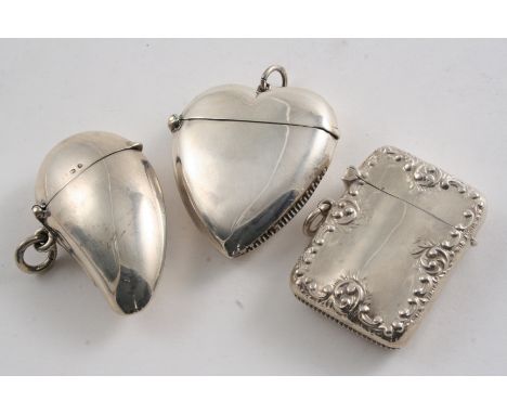 A LATE VICTORIAN PLAIN SILVER VESTA CASE in the form of a mussel shell, maker's mark worn, Birmingham 1898, another plain sil