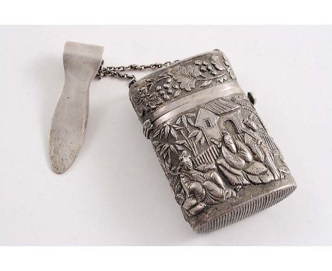 A LATE 19TH / EARLY 20TH CENTURY CHINESE SILVER VESTA CASE embossed with a scene of native figures in a landscape & vines, ma