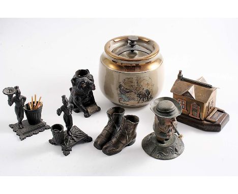 A MIXED LOT:- Two late 19th century cast iron figural vesta holders/strikers, a painted metal bulldog vesta holder/striker, a