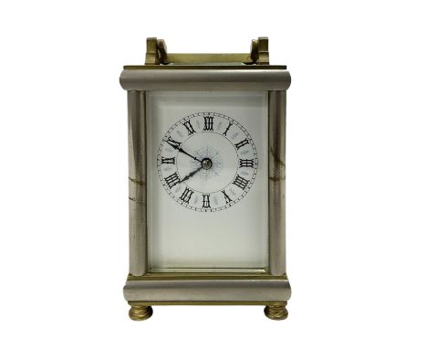French-early 20th century timepiece carriage clock, in a polished steel and brass case on bun feet, white enamel dial with go