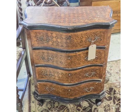 SERPENTINE COMMODE, mid 19th century Italian tulipwood and ebonised with four drawers and allover parquetry and ebonised deta